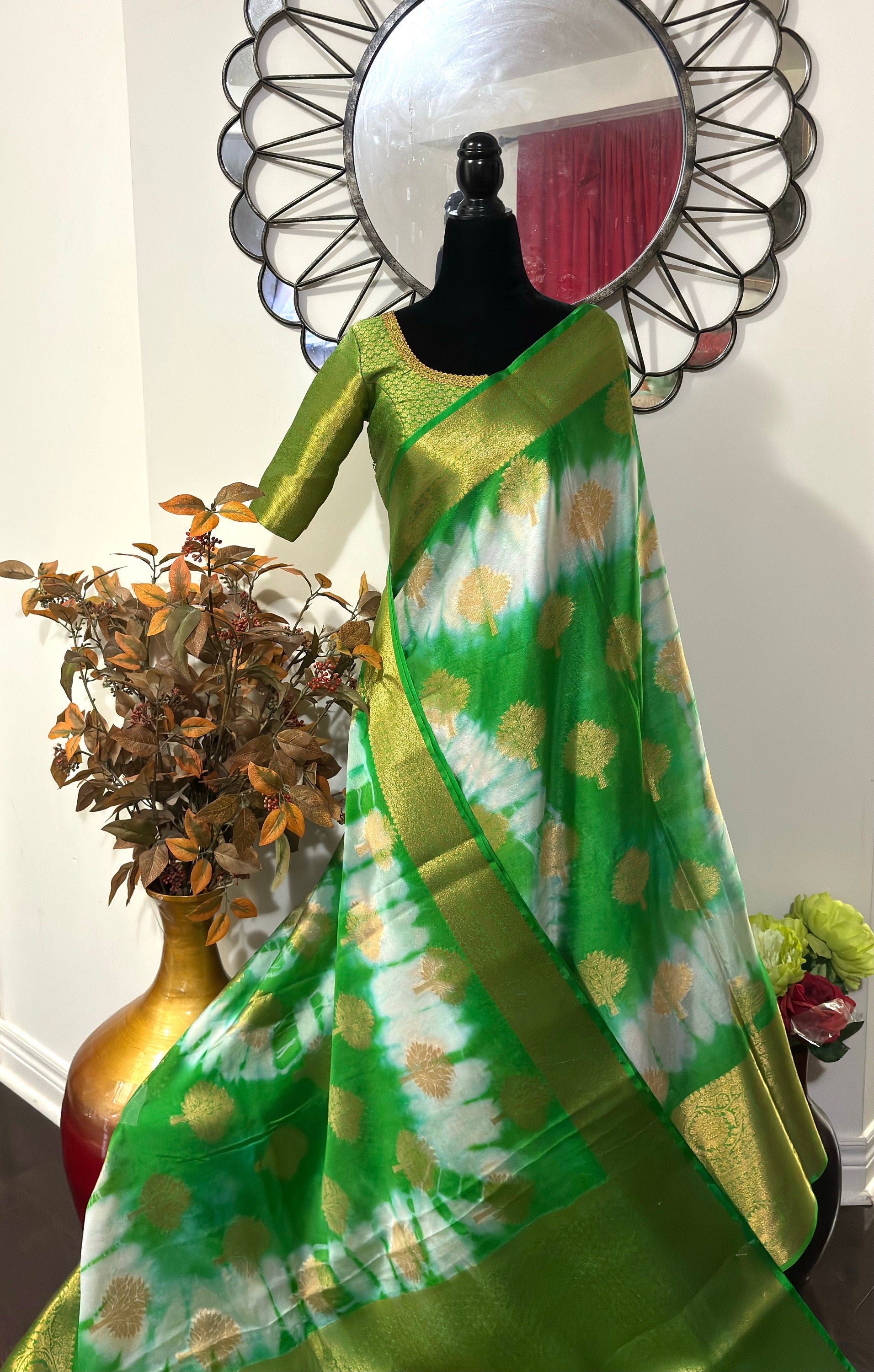 Banarasi kora organza saree with beautiful tie and dye all over the saree. Saree is ready with beautiful designer blouse that fit to 32-46