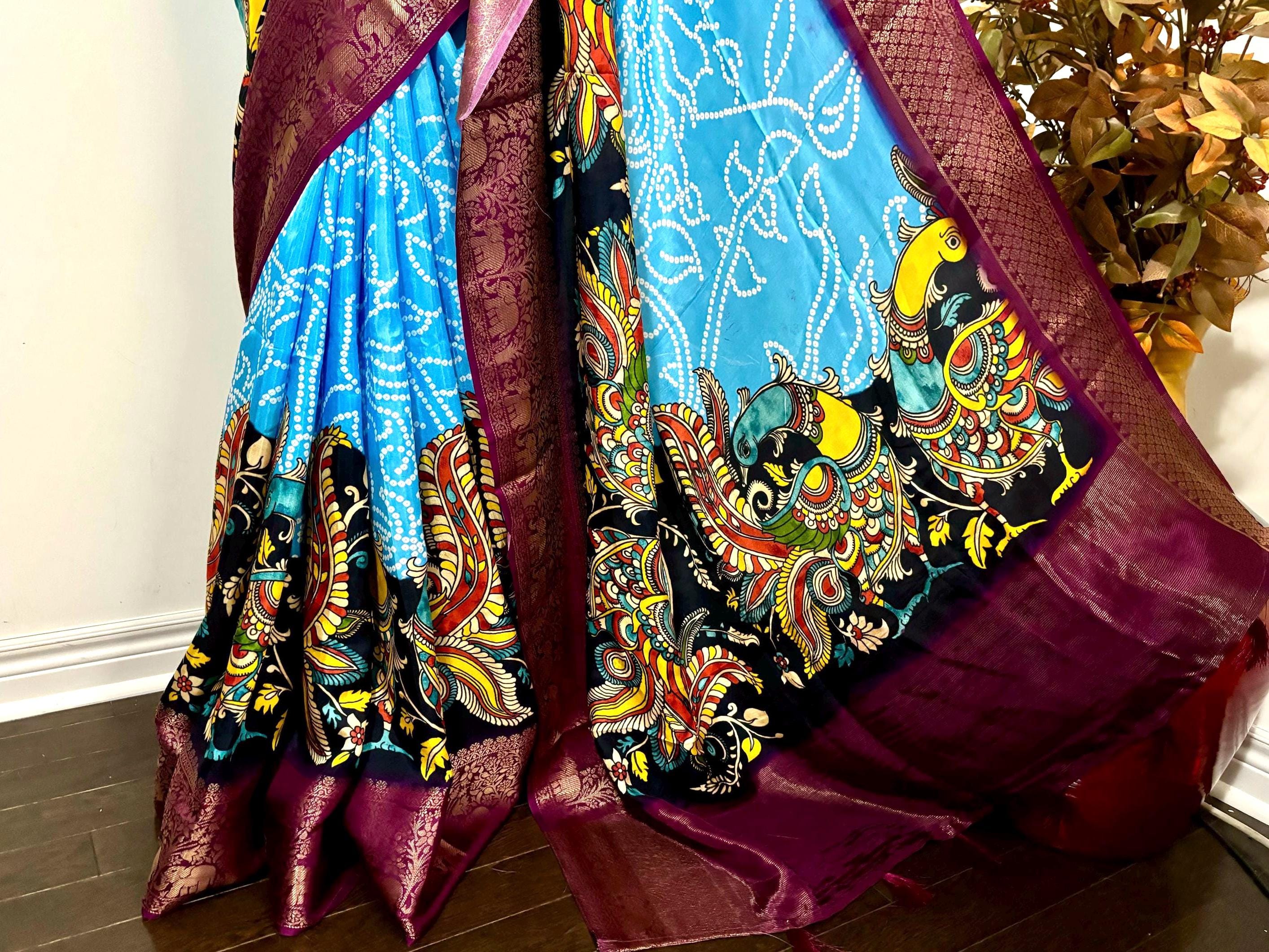 Beautiful pure silk bandini silk saree paired up pretty blouse sizes 32 -46 ready to wear.With Zari boarders elephant prints and peacocks