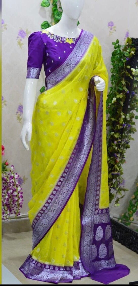 Beautiful banarasi saree paired up with pretty maggam work blouse.
