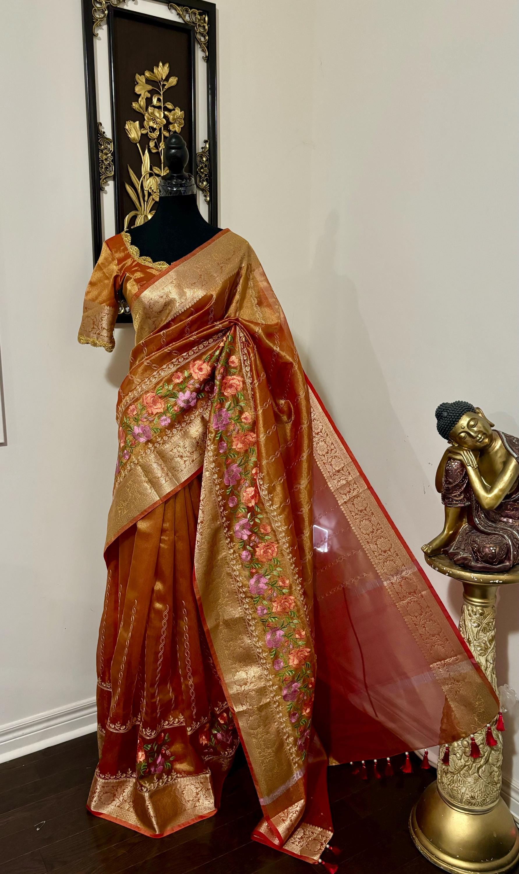 Banarasi  tissue saree with self weaving with beautifully embroidered boarder all over the sareeOrange Gold  shade rich weaving ready Blouse