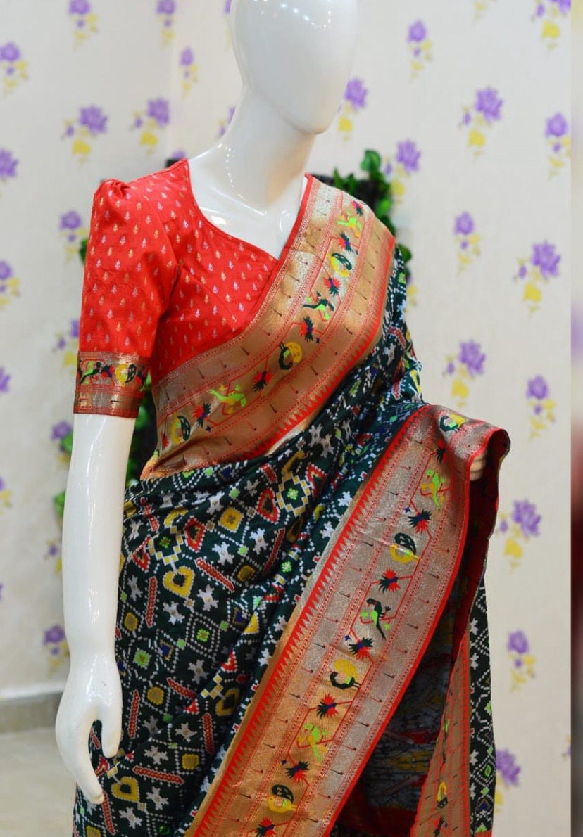 Beautiful patola paithani saree paired up with pretty banaras weaving blouse