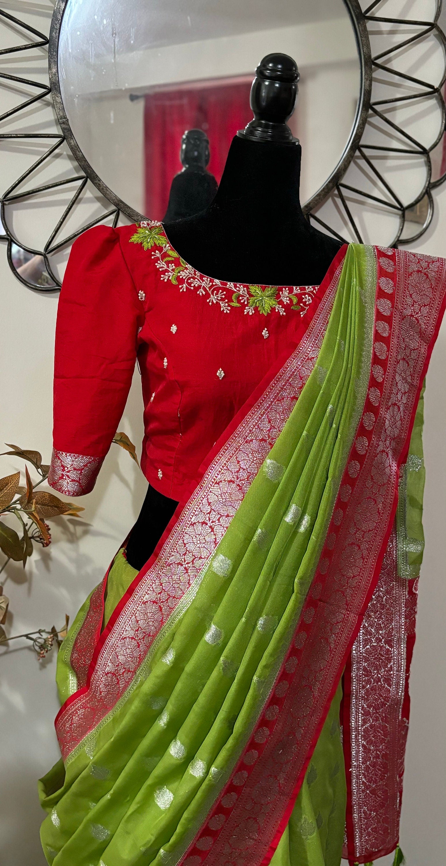 Beautiful banarasi saree paired up with pretty maggam work blouse.