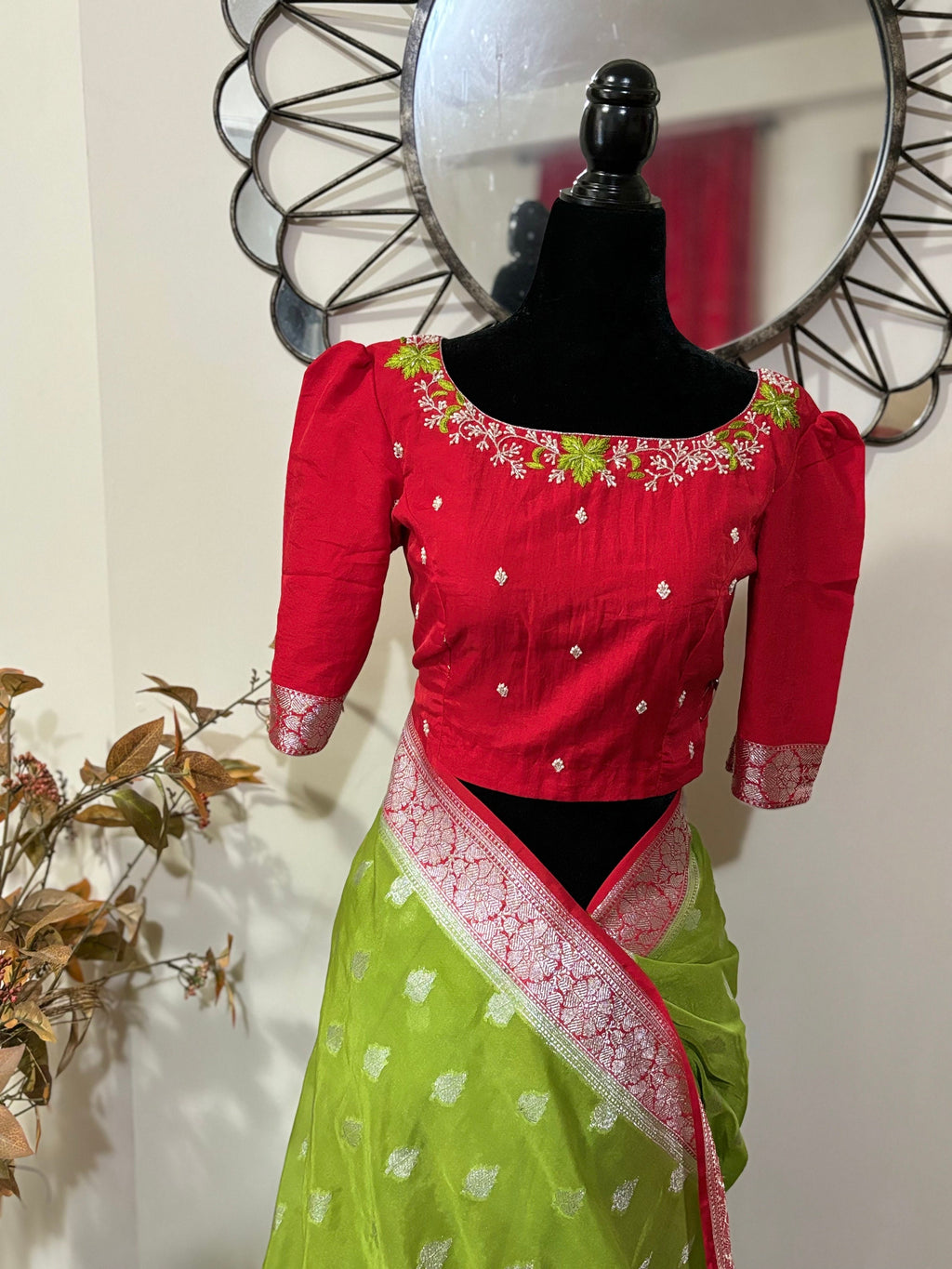 Beautiful banarasi saree paired up with pretty maggam work blouse.