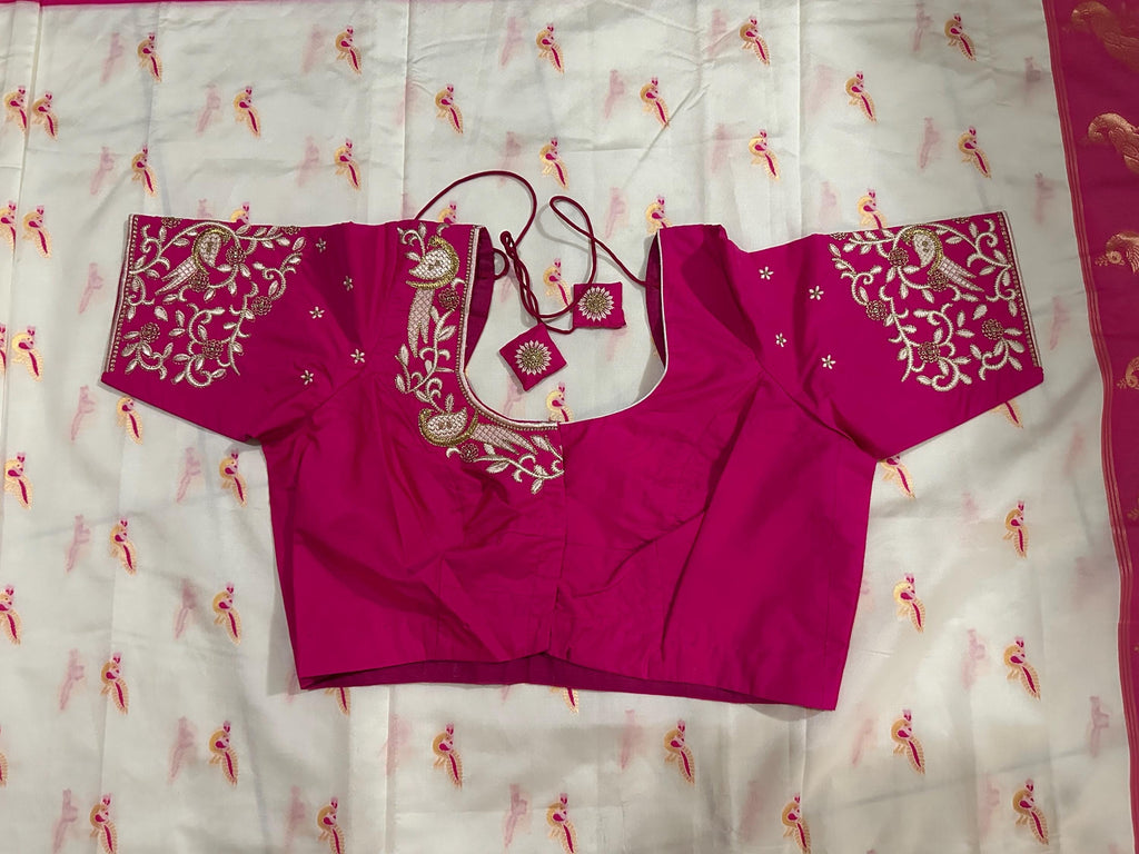 Beautiful soft white and pink paithani silk saree with all over zari weaving along with handwork on blouse