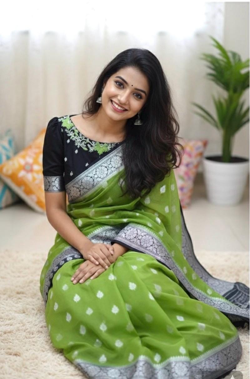 Beautiful banarasi saree paired up with pretty maggam work blouse.