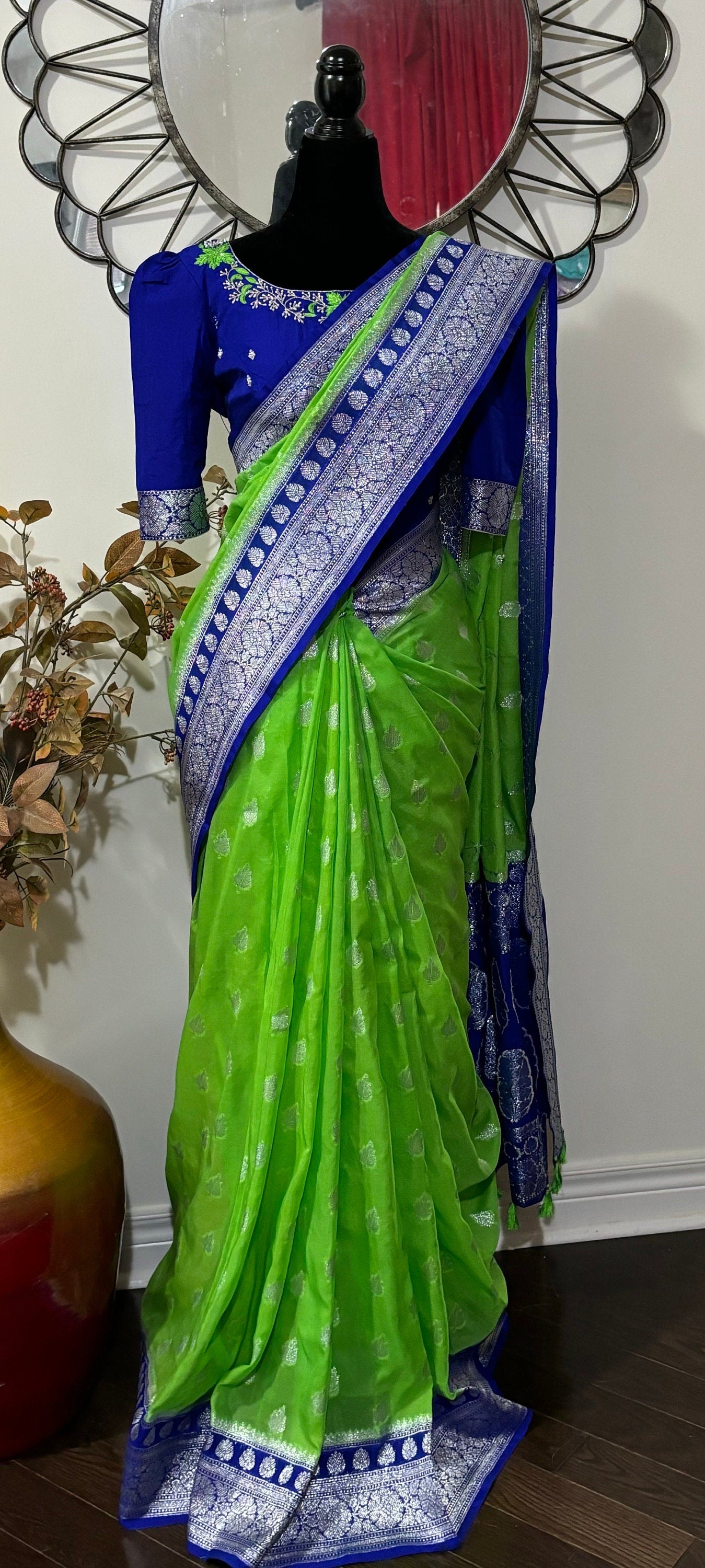 Beautiful banarasi kattan saree paired up with pretty maggam work blouse.