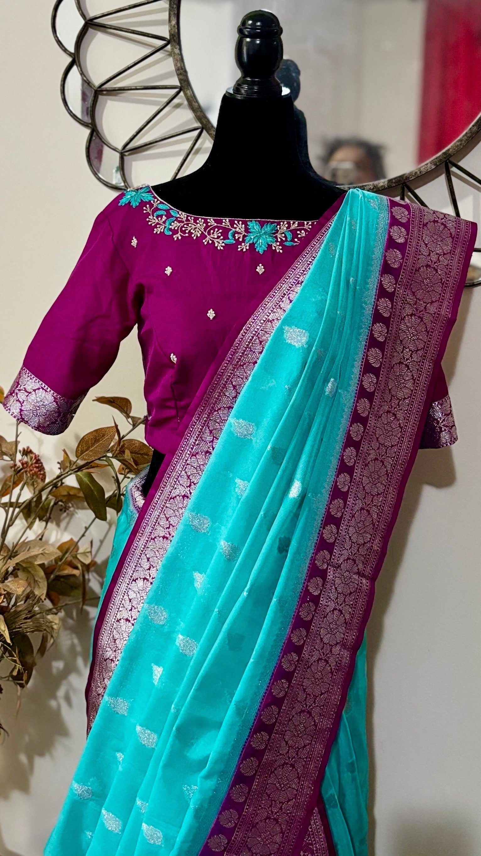 Beautiful banarasi saree paired up with pretty maggam work blouse.