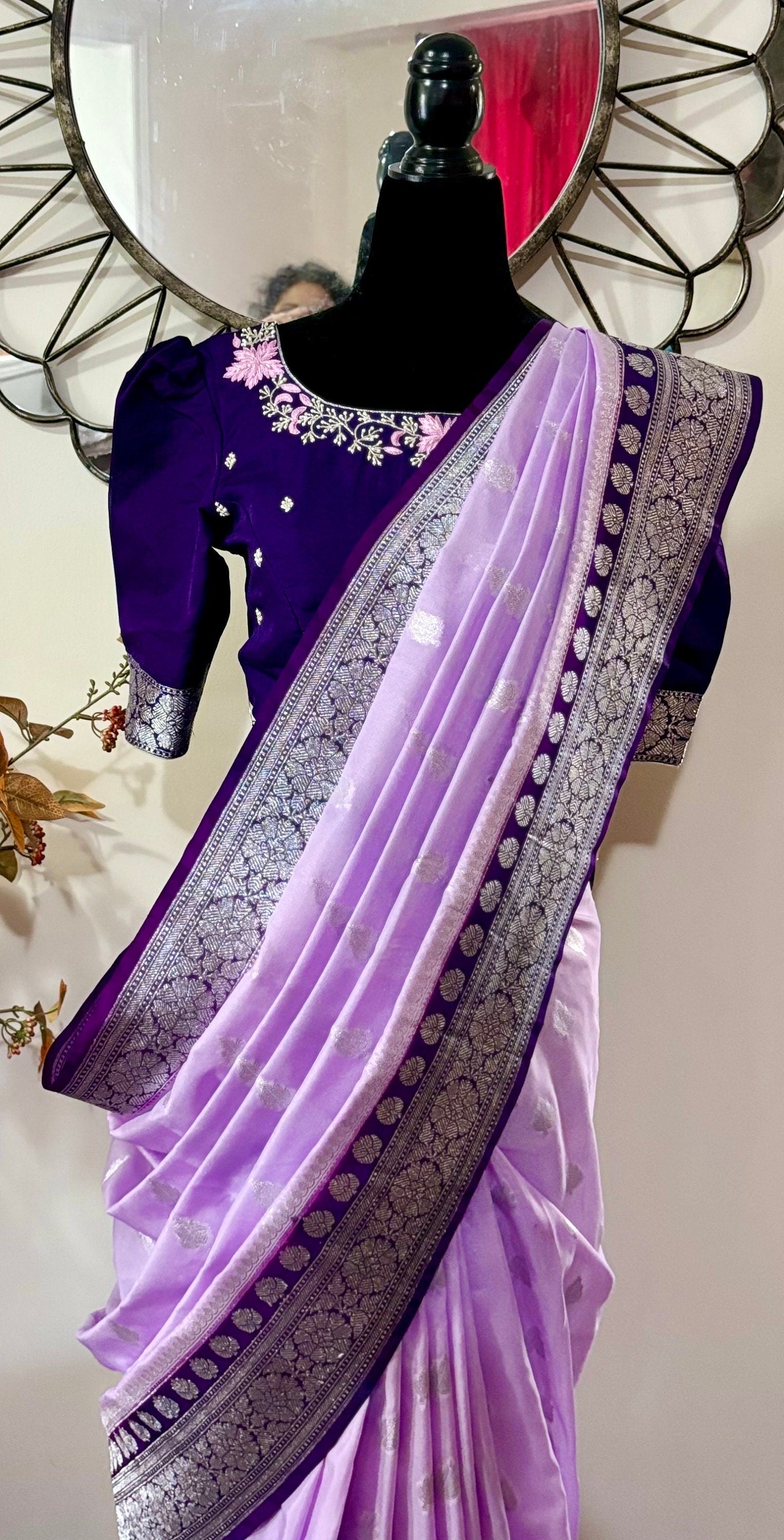 Beautiful banarasi saree paired up with pretty maggam work blouse.