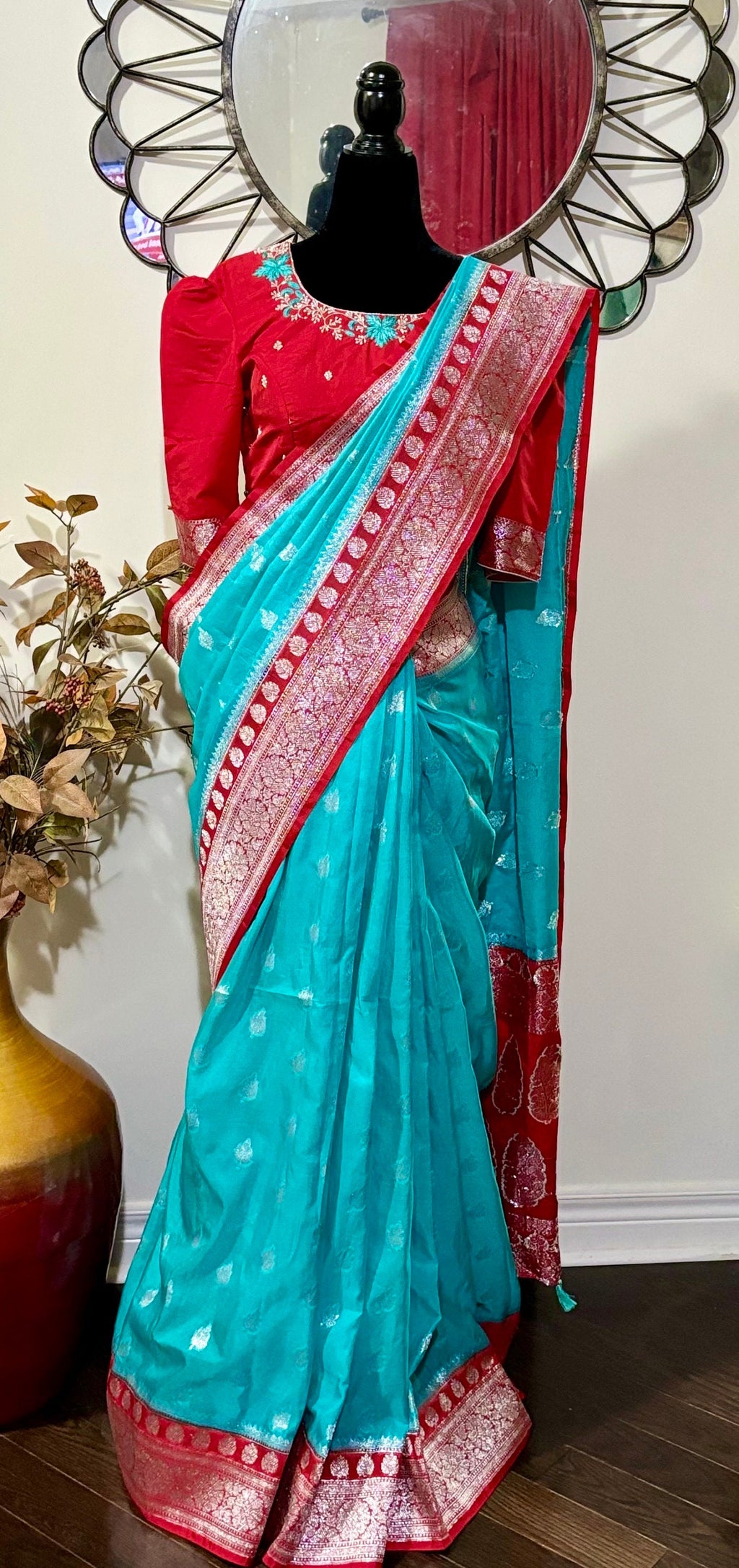 Beautiful banarasi saree paired up with pretty maggam work blouse.