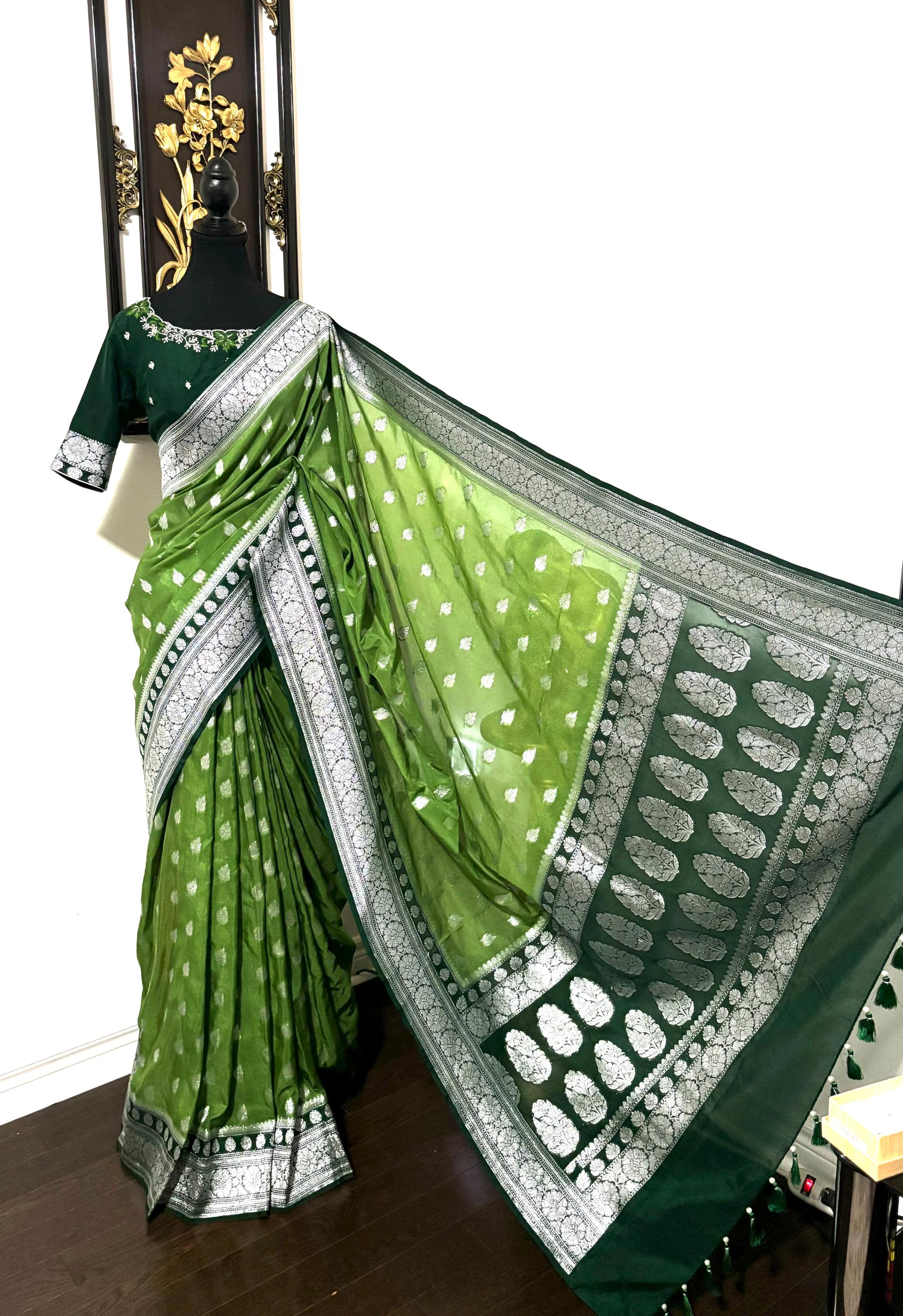 Beautiful banarasi saree paired up with pretty maggam work blouse.dits to 32-46