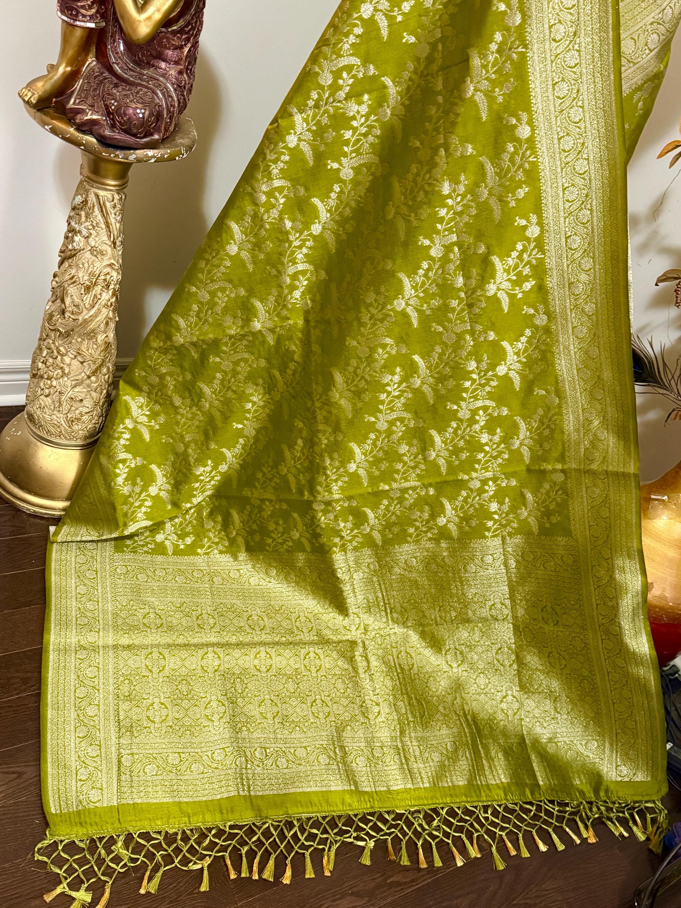 Beautiful banarasi saree with silver Zari weaving all over the saree paired up with pretty ready to wear  blouse that fits to 32 to 46