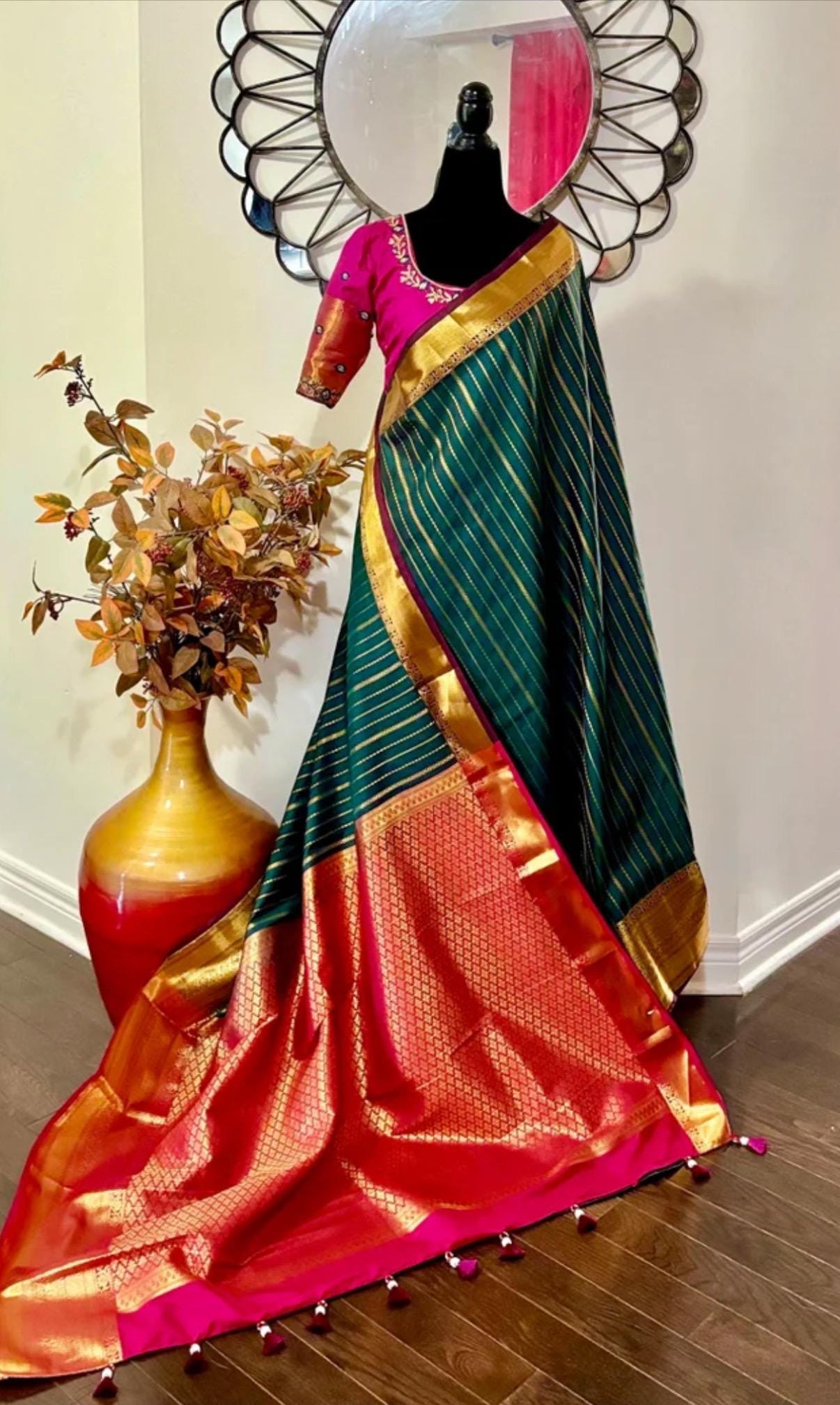 Kanchipuram soft silk saree in rarecolors with beautifully done hand  made embroidered blouse with readytowear work blouse fitsup to32 to 46