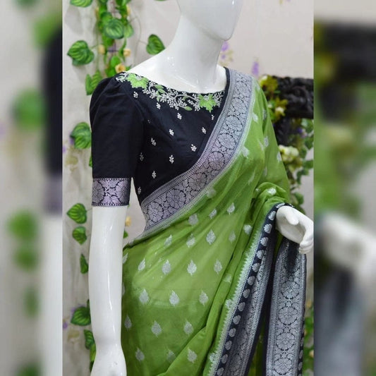 Beautiful banarasi saree paired up with pretty maggam work blouse.