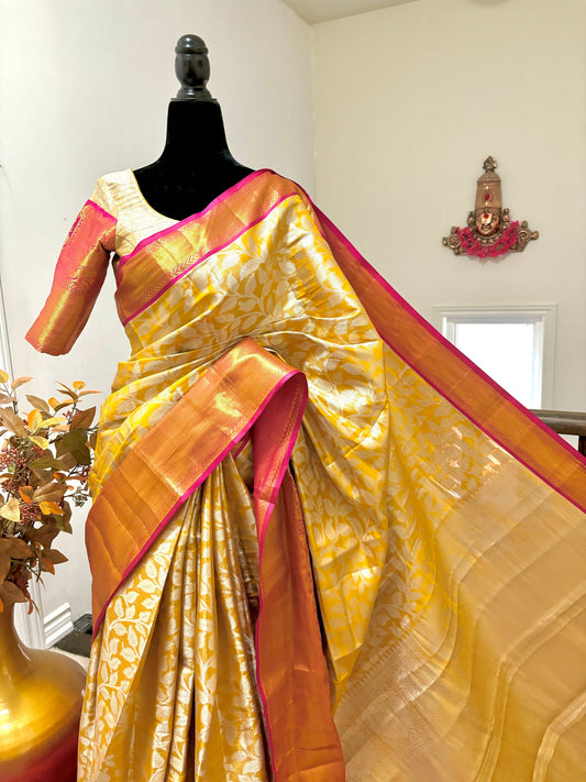 Yellow color self beautiful design Banarasi silk with Kanchi boarder with ready to wear designer blouse fits up to 32 to 40