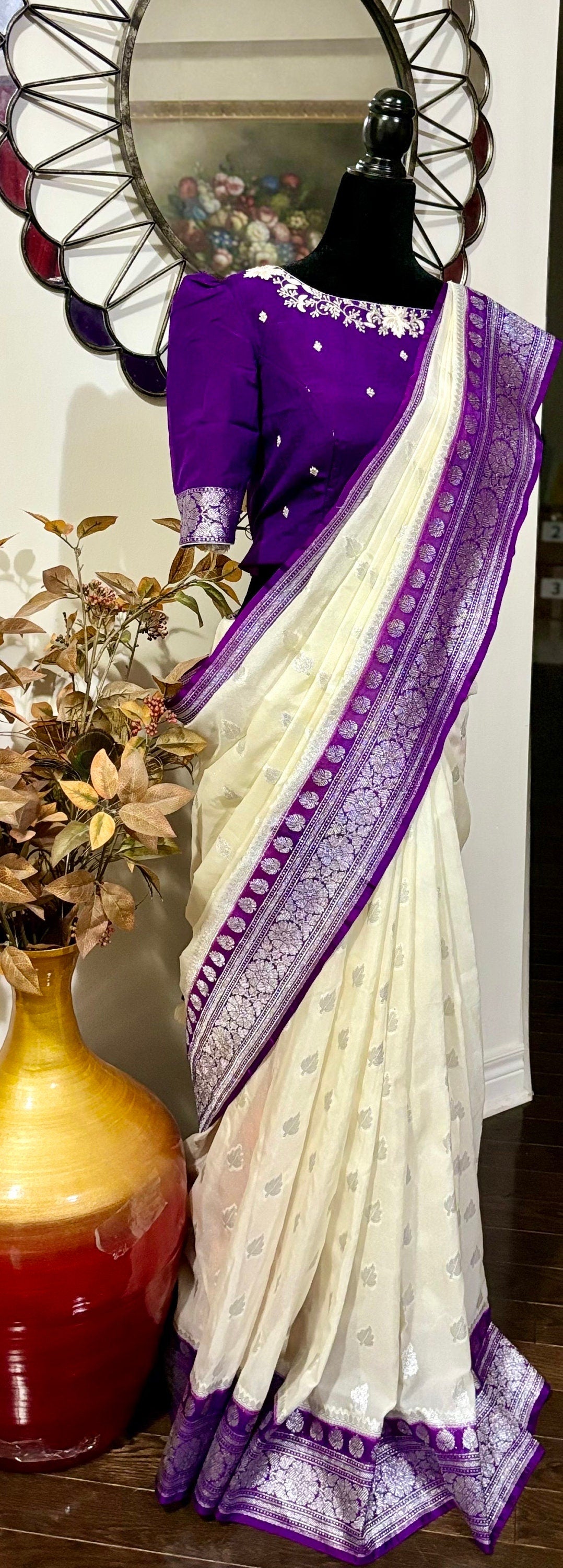 Beautiful banarasi saree paired up with pretty maggam work blouse.dits to 32-46