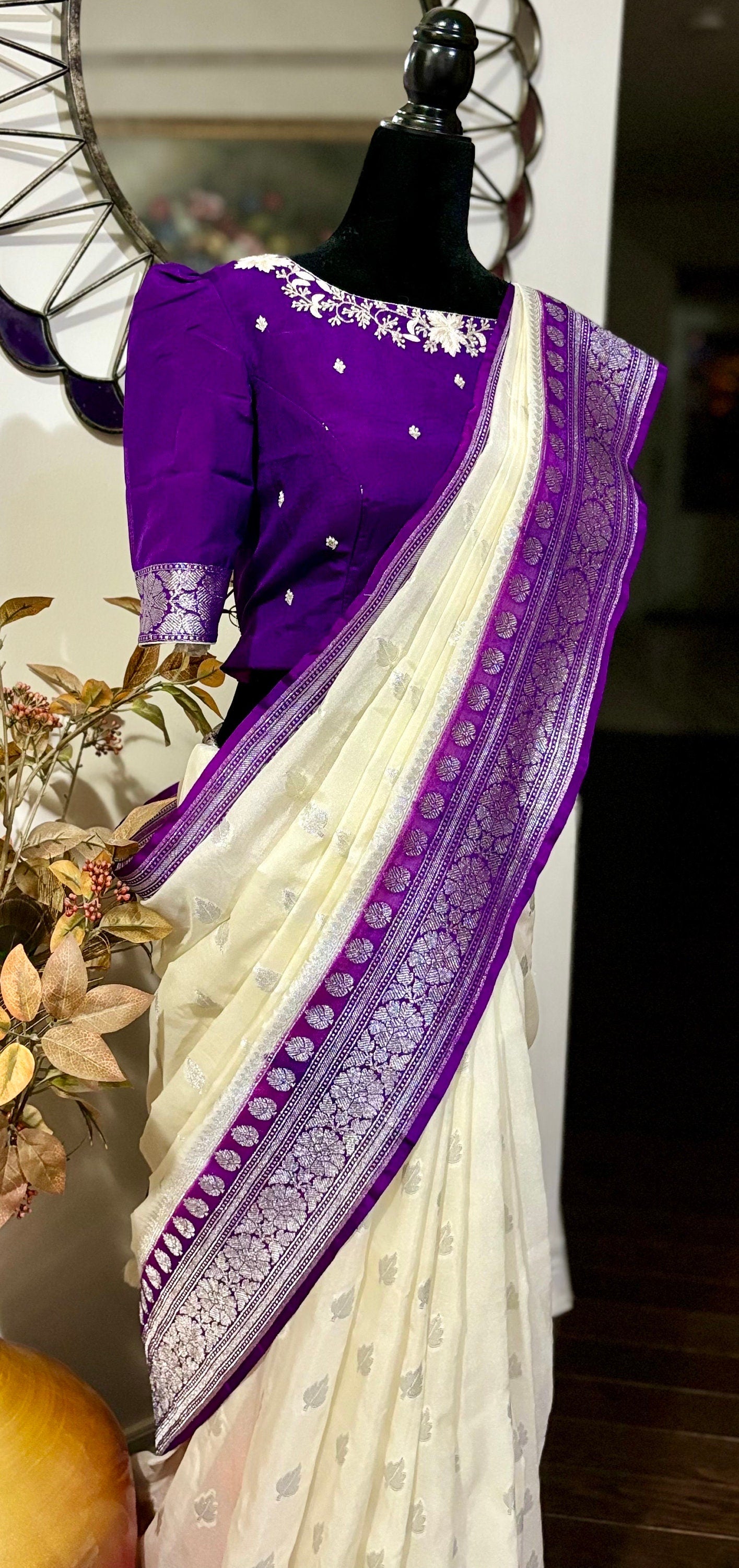 Beautiful banarasi saree paired up with pretty maggam work blouse.dits to 32-46