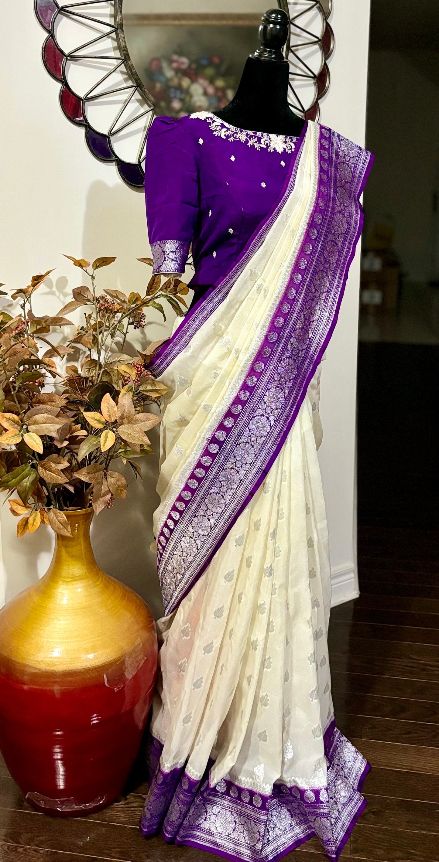 Beautiful banarasi saree paired up with pretty maggam work blouse.dits to 32-46